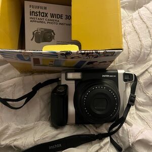 Fujifilm is tax wide 300 polaroid camera